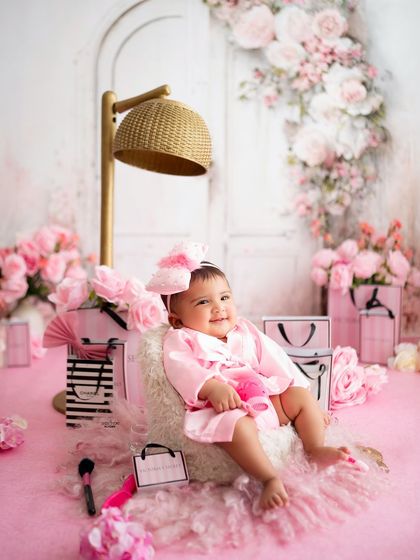 This little marshmallow is enjoying her spa day, sitting in a comfy chair in her pink robe.