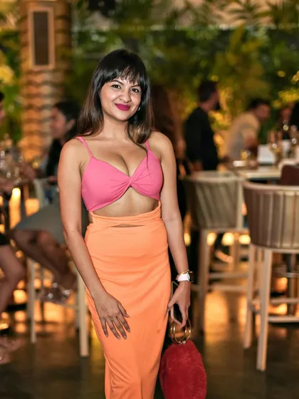 A stylish guest posing for the camera. The fashion at Pangeo is always on point.