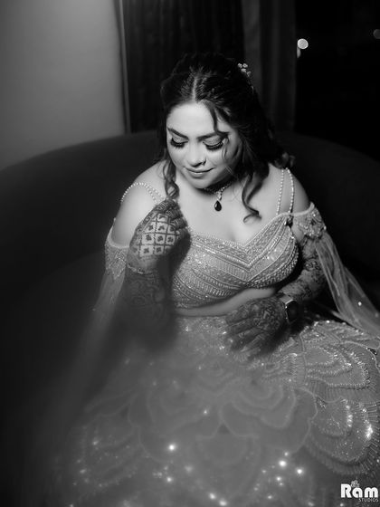 A timeless black and white portrait of the bride on her engagement night. The focus on her expression and the sparkling details of her dress creates a classic and emotive image.