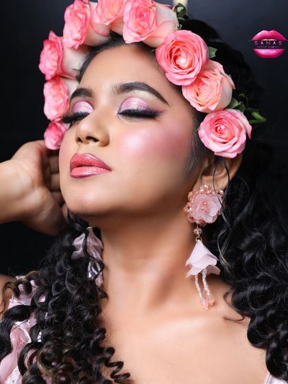 A final shot of this stunning look, perfect for a garden wedding or a spring-themed ceremony. The makeup is soft, the hair is beautifully styled, and the overall effect is magical.