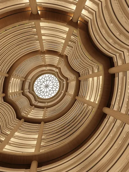 Looking up through the central atrium of Palais Royale, one of India’s tallest residential towers. This 215-meter vertical space is an engineering marvel that bathes the interiors in natural light, creating a sense of immense scale and spatial harmony.