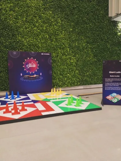 I bring oversized fun with games like this giant Ludo setup. It's a fantastic icebreaker and a fun activity for guests of all ages at any gathering, from Diwali parties to corporate picnics.