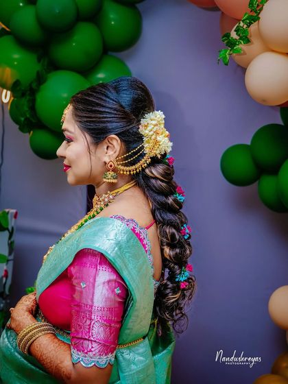 A duplicate of 163, this shot beautifully showcases the traditional details and elegance of the mother-to-be's appearance.