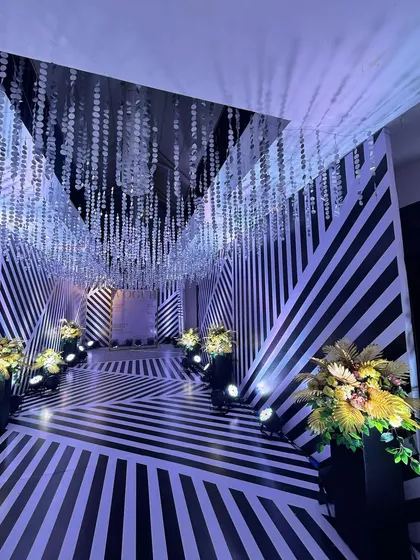 Another angle of the striking black-and-white passage, a testament to our love for bold and modern event design.