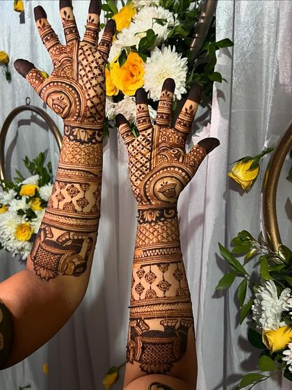 A classic bridal design with circular motifs and check patterns, set against a festive floral arrangement.