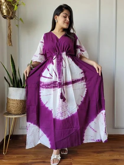 A striking purple and white tie-dye kaftan with a circular pattern. The soft cotton fabric and free-size design make it an incredibly comfortable and stylish choice.
