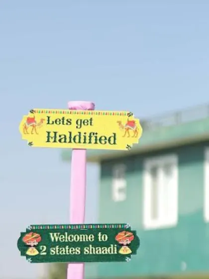 Quirky and fun directional signage like "Lets get Haldified" adds personality and guides guests through the event.