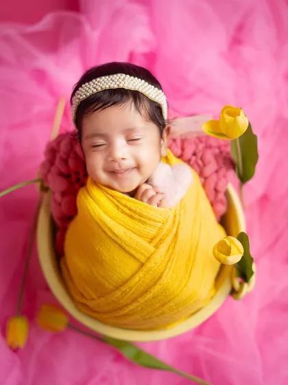 The smiles just keep coming. Capturing these joyful, sleepy expressions is one of the biggest rewards of being a newborn photographer.