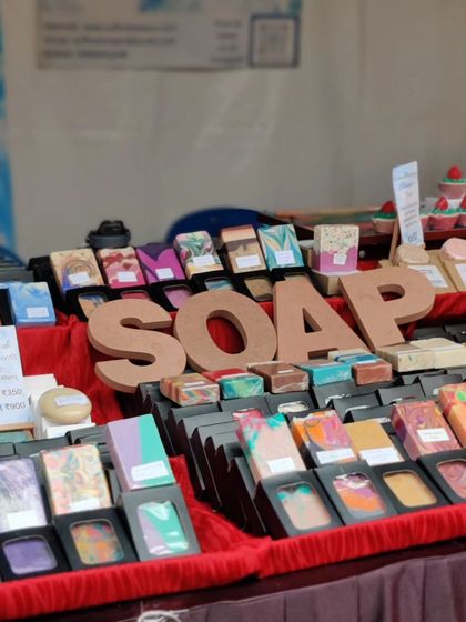 My soap display, with the "SOAP" letters making it clear what I'm selling! It's always fun to see people's reactions to my creative designs.