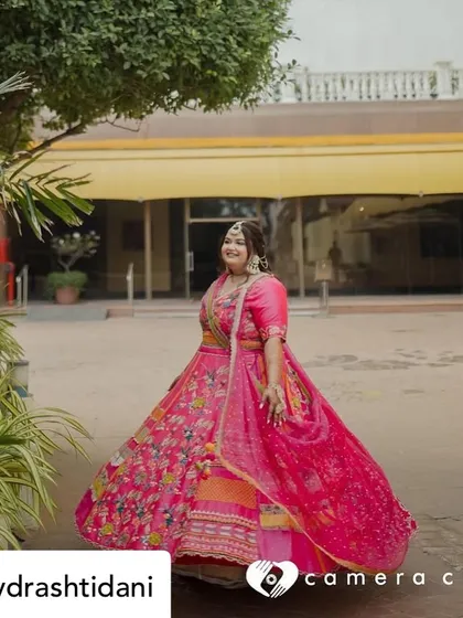A full-length shot capturing the joy and color of the Mehendi ceremony. Her makeup is designed to look bright and beautiful from afar.