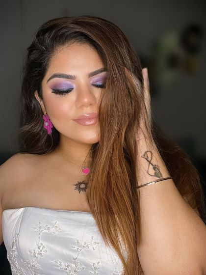 Eyes closed to show off the purple smokey eye. It's fun to play with color.