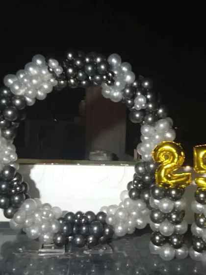 The same black and silver 25th birthday ring, showing its placement on a rooftop terrace.