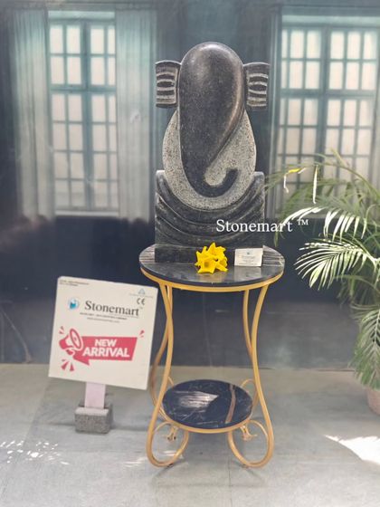 The black granite abstract Ganesha statue, standing 21 inches tall. Its minimalist form is perfect for architects and designers looking for a modern spiritual piece for hotels and resorts.