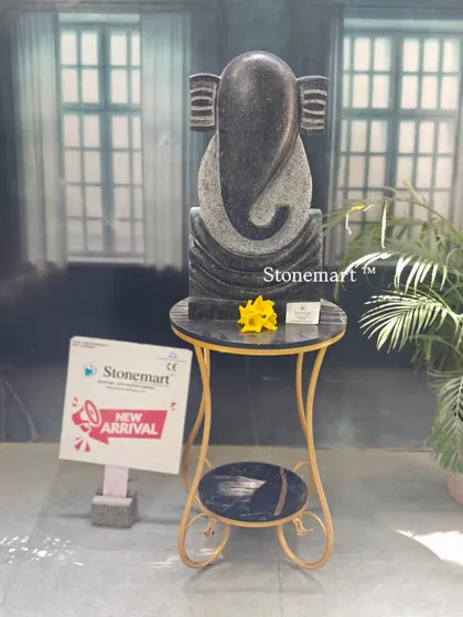 The black granite abstract Ganesha statue, standing 21 inches tall. Its minimalist form is perfect for architects and designers looking for a modern spiritual piece for hotels and resorts.