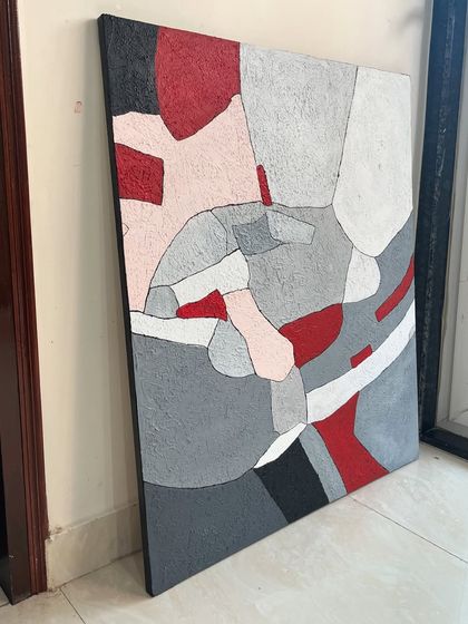A 2.5ft x 3ft textured abstract piece with a striking color combination of grey, pink, and red. The entire surface is textured, giving the geometric composition a rough, stone-like feel.