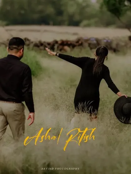 A cinematic shot of a couple walking through a tall grassy field, creating a sense of adventure and a story unfolding.