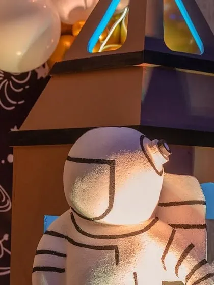 A life-sized astronaut prop, adding to the immersive experience of the space-themed birthday party.