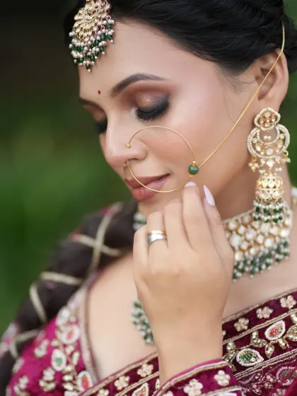 A no-filter, no-edit shot of a traditional North Indian bridal look with smokey eyes and a beautiful matha patti.