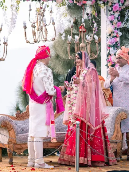 The couple at the mandap during the wedding ceremony. This shot captures a quiet, intimate moment between them amidst the rituals.