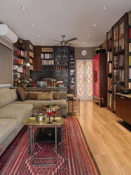 A full view of the linear study in the Courtyard Home, showing how we maximize space and function. The long sofa, custom media unit, and extensive bookshelves create a room that is perfect for both relaxation and intellectual pursuits.