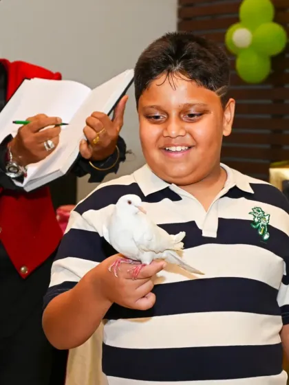 A great party is all about the fun. I can arrange fantastic entertainment, like this captivating magic show that had all the kids, including the birthday boy, completely spellbound. It’s these moments of wonder that make a celebration unforgettable.