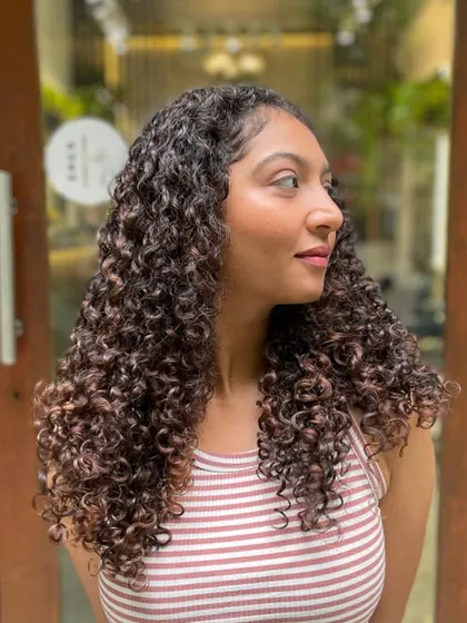 Sometimes all your curls need is a little bit of shaping to bring them to life. This client's hair looks fantastic after a maintenance cut.