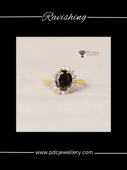 A ravishing ring featuring a large black semi-precious stone surrounded by a halo of diamonds. The contrast between the dark stone and the sparkling diamonds creates a dramatic and elegant look.