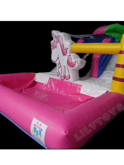 Our unicorn pool inflatable is a fantastic addition to any summer party. This rental combines a small splash pool with a slide, decorated with a unicorn and palm trees for a tropical, magical feel.