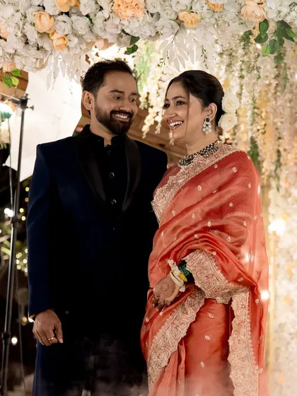 Another candid moment of laughter between the bride and groom.