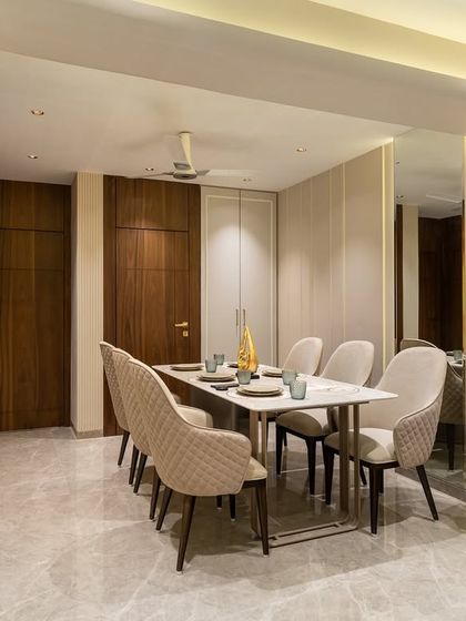 Subtle elegance meets functionality in this sophisticated dining space. A warm neutral palette, quilted textures, and gold accents come together to create a setting that’s both inviting and refined, perfect for effortless hosting and everyday luxe.