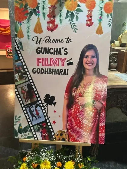 A personalized welcome sign for a 'Filmy Godh Bharai'. We incorporate the mom-to-be's photo into a movie-themed design, setting the tone for a fun and unique celebration right from the entrance.