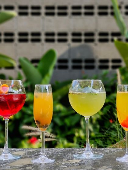 A colorful lineup of our signature cocktails, ready to be enjoyed in our garden setting.