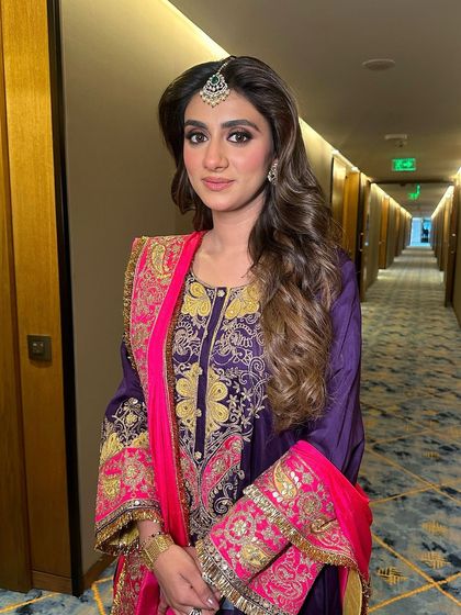 Another angle of this festive Karwachauth look, showing the beautiful soft waves and the way the makeup enhances her features.