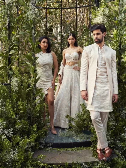 A beautifully styled group in coordinated ivory and beige. I work with you to create looks that feel connected, from the groom's attire to the bridesmaids' dresses.