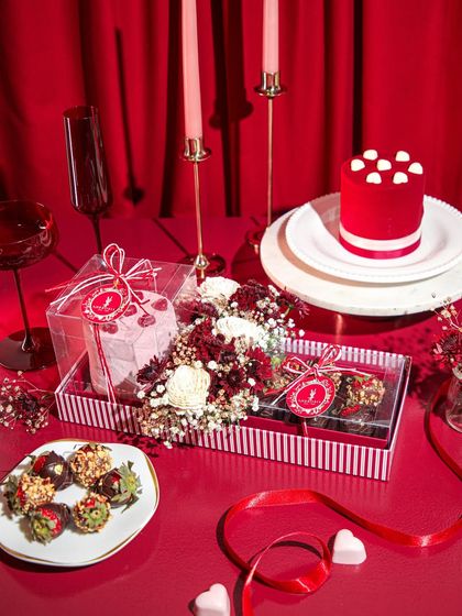 Our full Valentine's Day hamper, featuring a red velvet cake, chocolate strawberries, and other decadent treats.