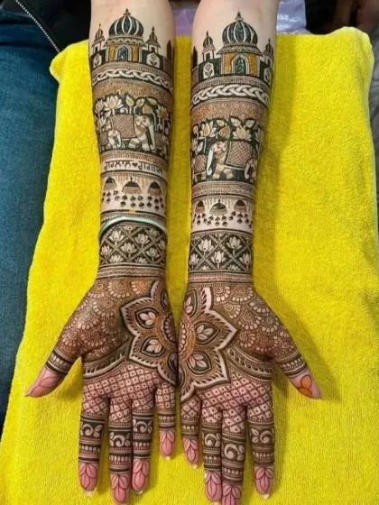 Inspired by grand architecture, this design features the silhouette of the Taj Mahal on the forearms. The rest of the mehndi is filled with elephants and intricate geometric patterns.