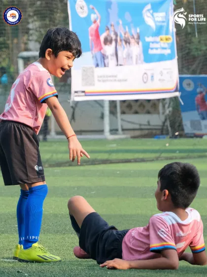 Football is about more than just the game. It's about sportsmanship and creating memories, like this moment of playful banter between two young players.