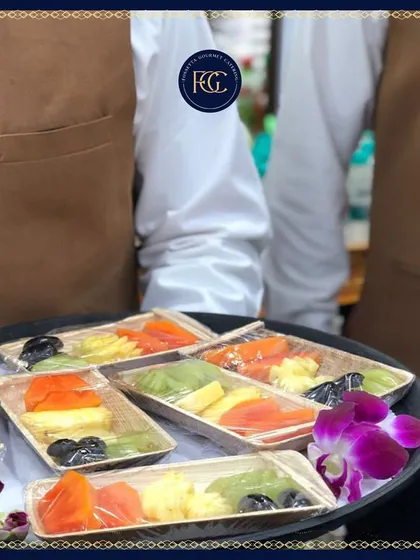 A closer look at our individual fruit platters, featuring a colorful assortment of papaya, kiwi, and melon. This is a refreshing choice for daytime events or as a light dessert.