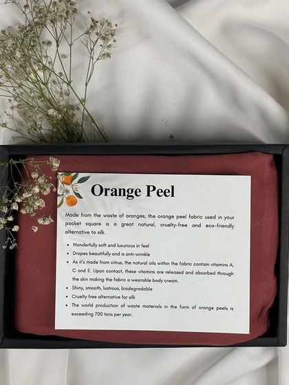 A gift that tells a story of sustainability. This set features a pocket square made from innovative 'orange peel' fabric, a cruelty-free and eco-friendly alternative to silk that is wonderfully soft and luxurious to the touch.