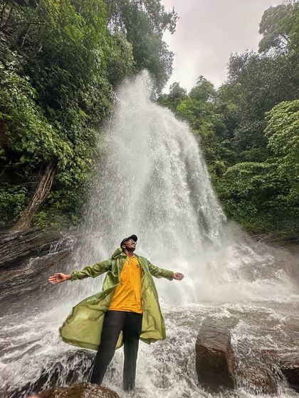 A trekker stands in awe before the powerful Hidlumane Falls. This is one of the main attractions of our Kodachadri trek.