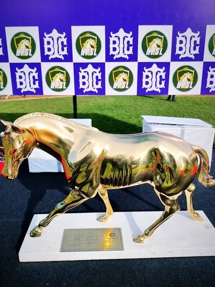 The Foster's Bangalore Winter Million trophy, a golden running horse sculpture.