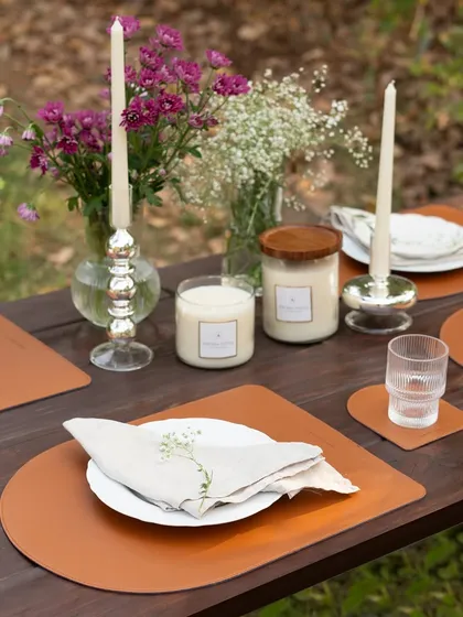 A complete view of a layered tablescape, where our taper candles and lidded jar candles add warmth and elegance. This setup demonstrates how fragrance and light can be the final touch for a beautiful gathering.