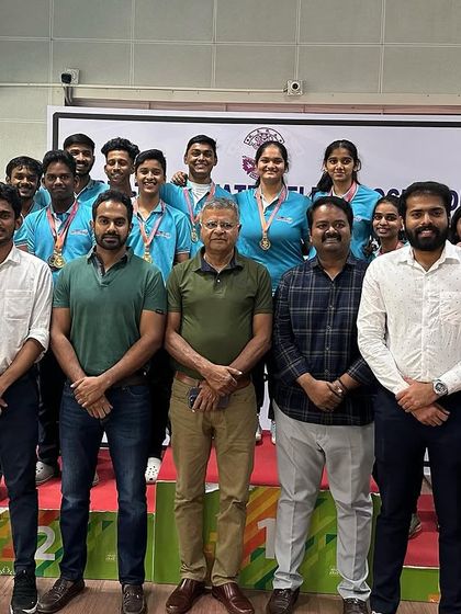 Our team with officials after winning 34 medals at the Nagaraja Jagdale State Shooting Competition.