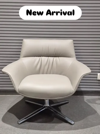 Another view of our new swivel lounge chair, highlighting its clean silhouette and polished chrome base.