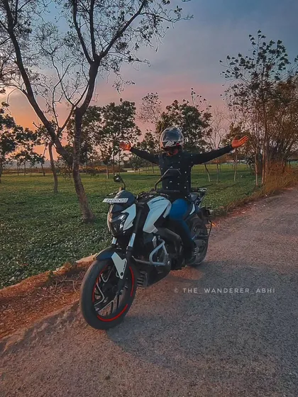 Chasing sunsets through the tea gardens of Dooars, North Bengal. The feeling of freedom with arms outstretched against a beautiful sky.