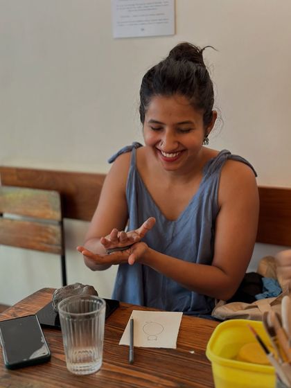 A smile of pure enjoyment. My goal is to create a space where people feel comfortable to play, experiment, and discover their own creativity.