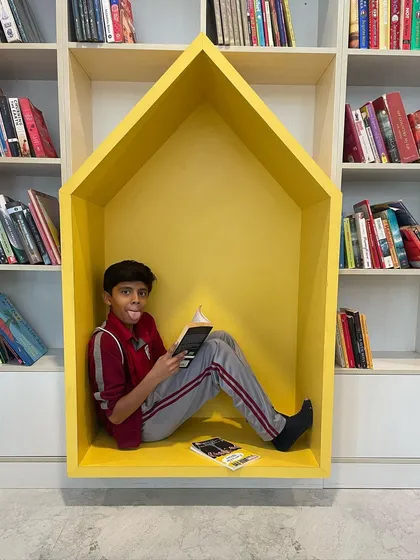 Another reading nook from our "quick-fix" series, this time in the shape of a house. The bright yellow color and simple geometry provide a cheerful and imaginative hideaway within the family library.
