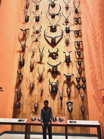 One of our players standing before an impressive wall of horns at the museum. A truly awe-inspiring sight.