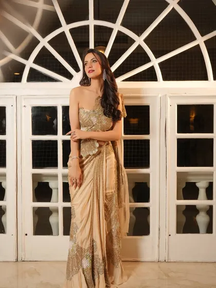 A classic full-length shot. The styling of this golden gown is timeless, ensuring the client looks and feels her best.