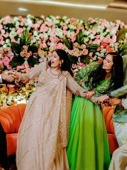 A playful tug-of-war between the bride's and groom's families and friends, a fun and candid moment from the reception.